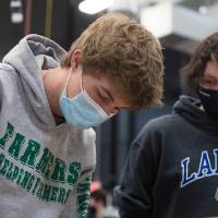 Students adjust their robot